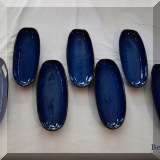 K21. 7 Blue ceramic corn cradles. - $18 